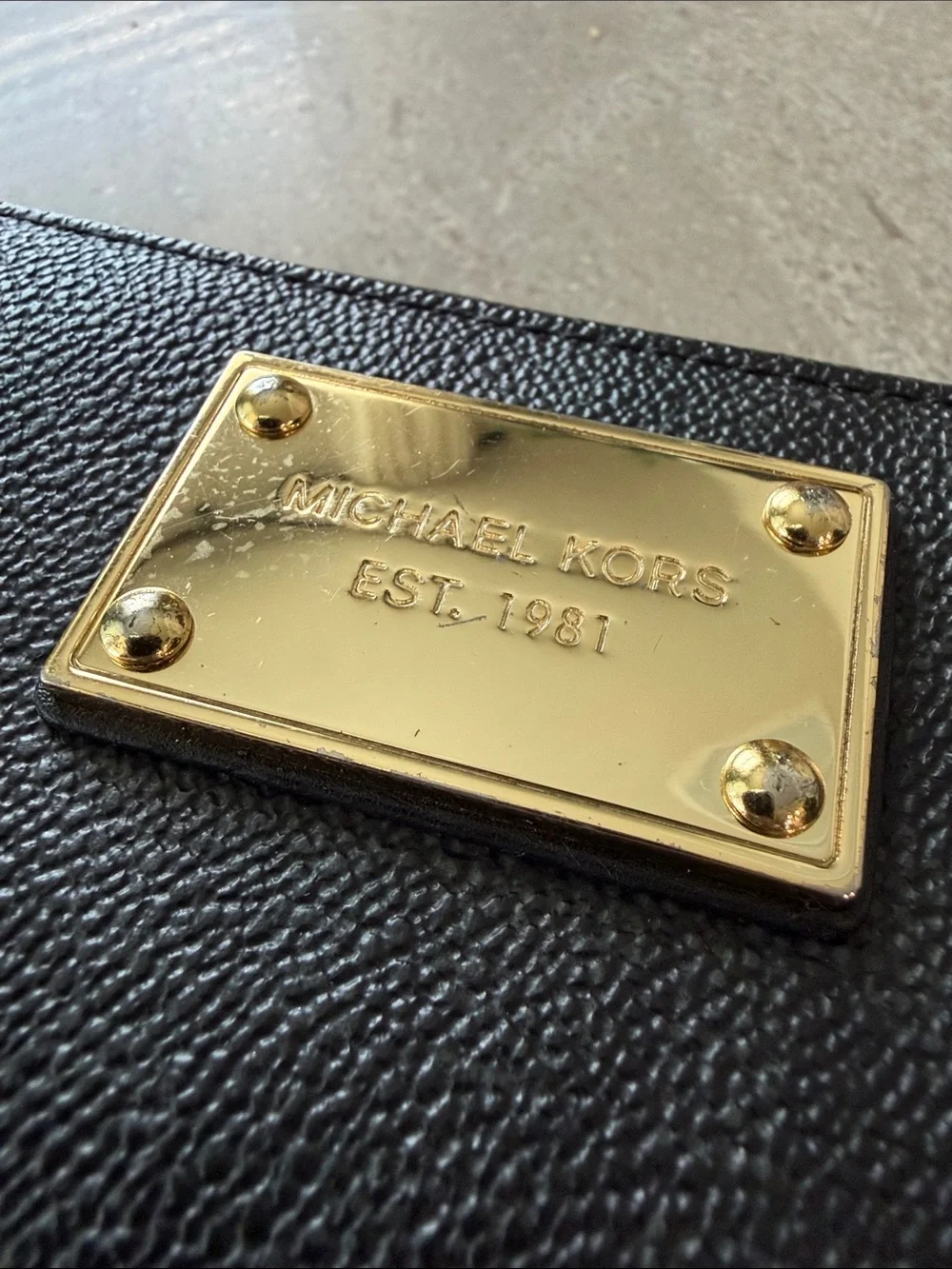 Michael Kors Black Zip-Around Wallet with Gold Logo Plate